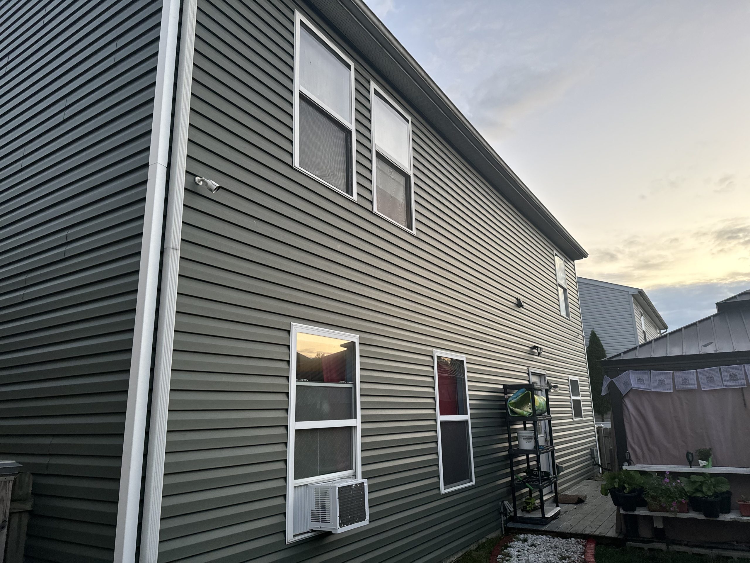 Green Siding on two story home